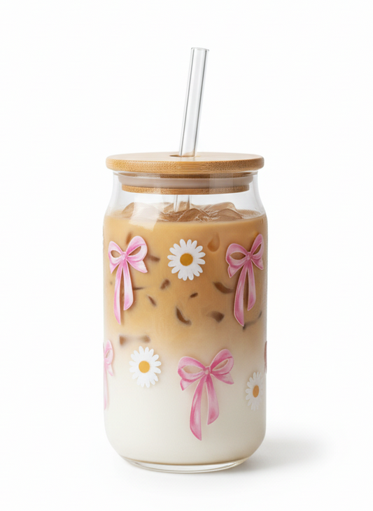 Jar with floral design and straw on a white background