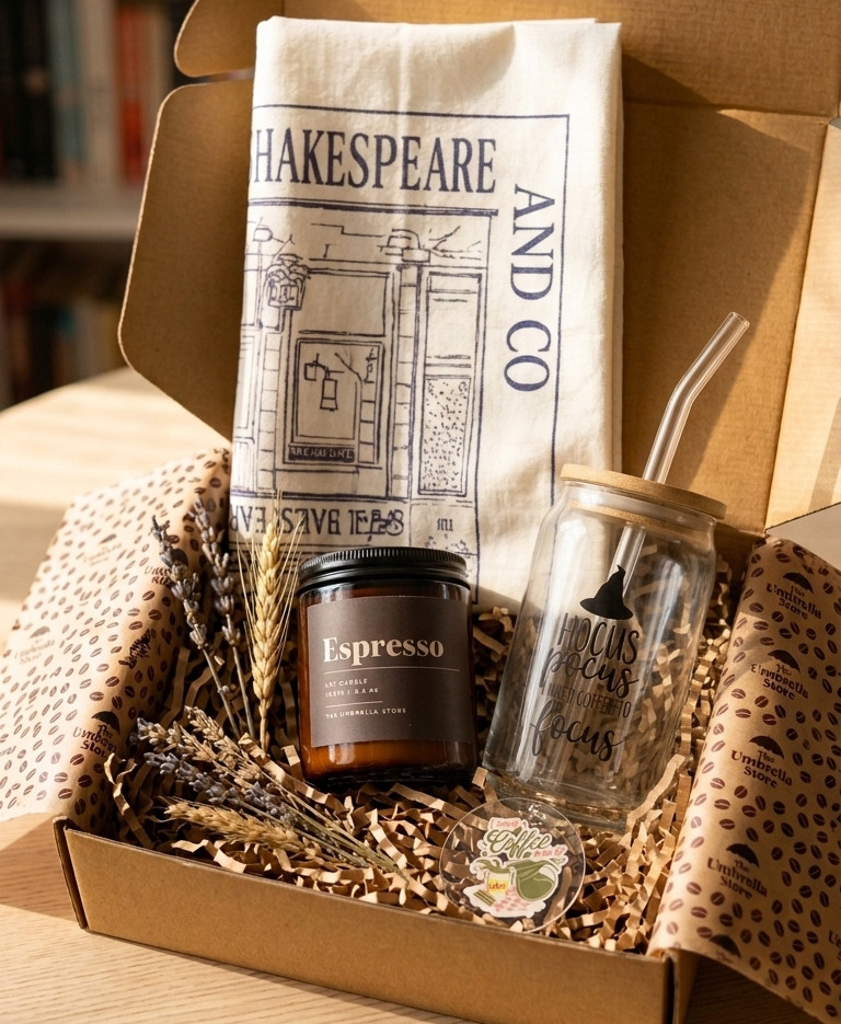 Gift set with 'Espresso' candle, glass tumbler, and 'Shakespeare and Co.' towel in a box.