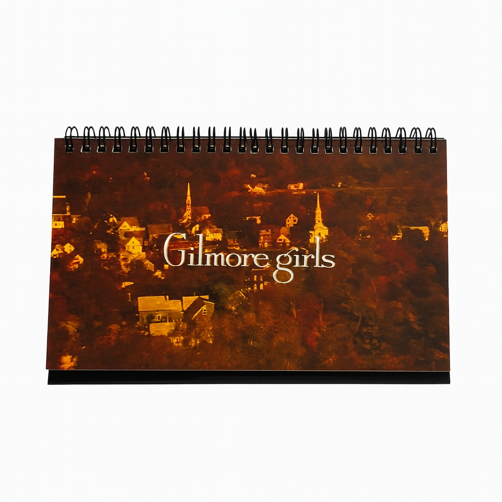 Notebook with 'Gilmore Girls' title on a cityscape background