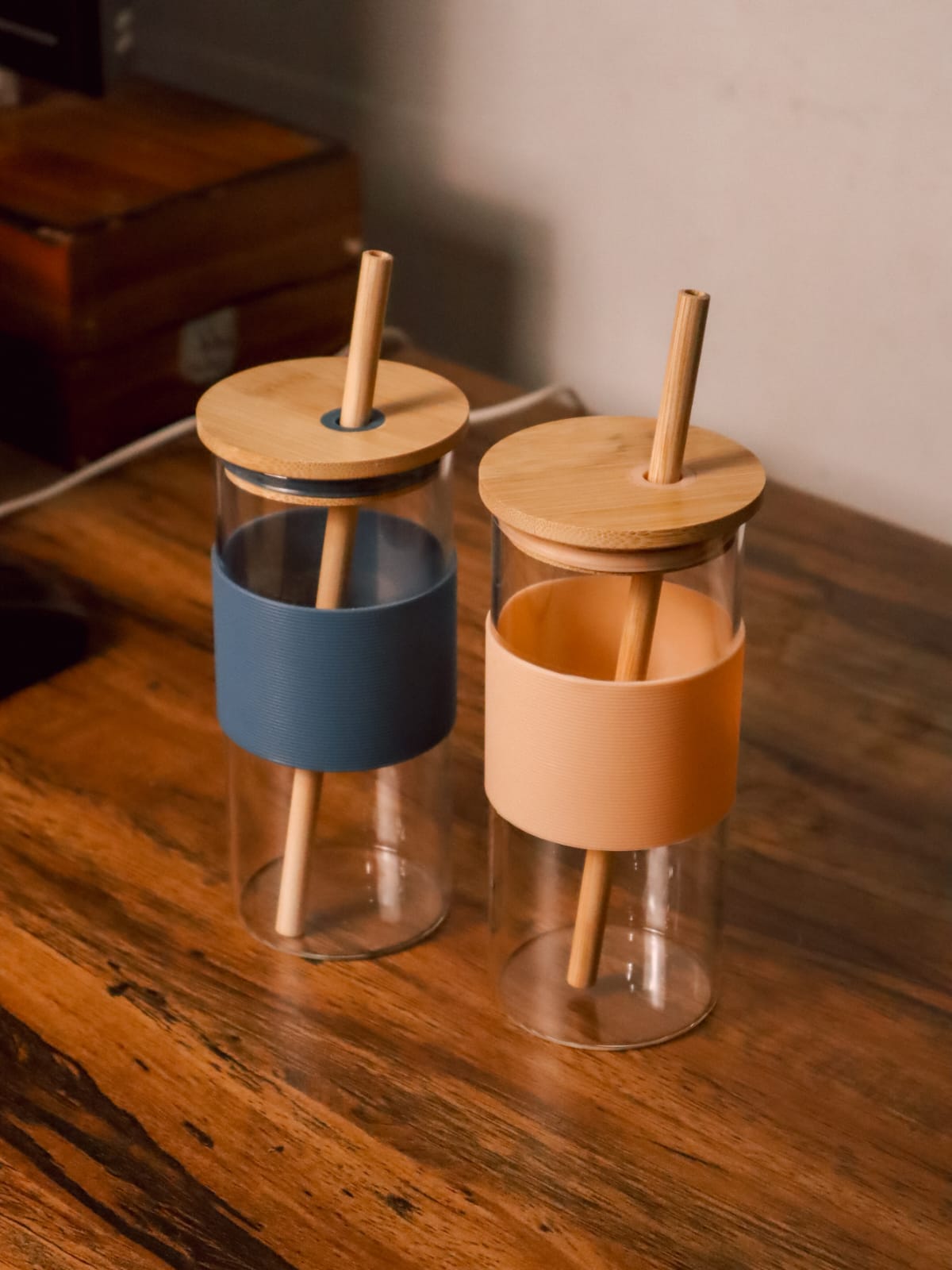 Glass tumbler with bamboo straw and silicone sleeve