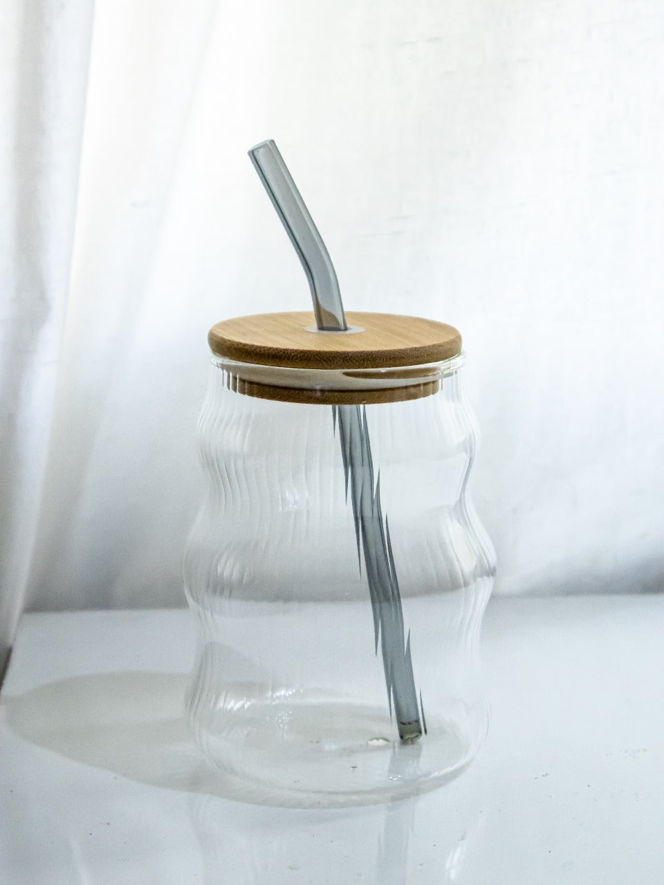 Fluted glass tumbler with straw