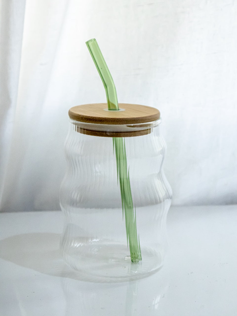 Fluted glass tumbler with straw