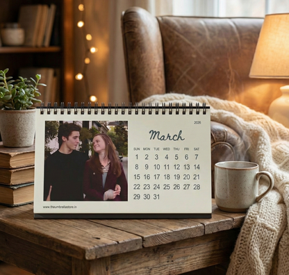 Calendar on a wooden table with a cozy living room background