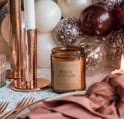 Scented candle on a dinner table setting